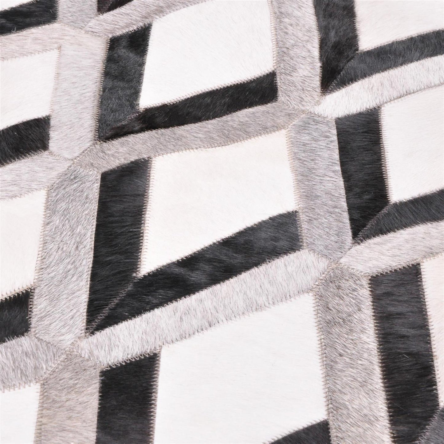 Patchwork Kuhfell Teppich weiß grau schwarz Karo Raute 3D genäht